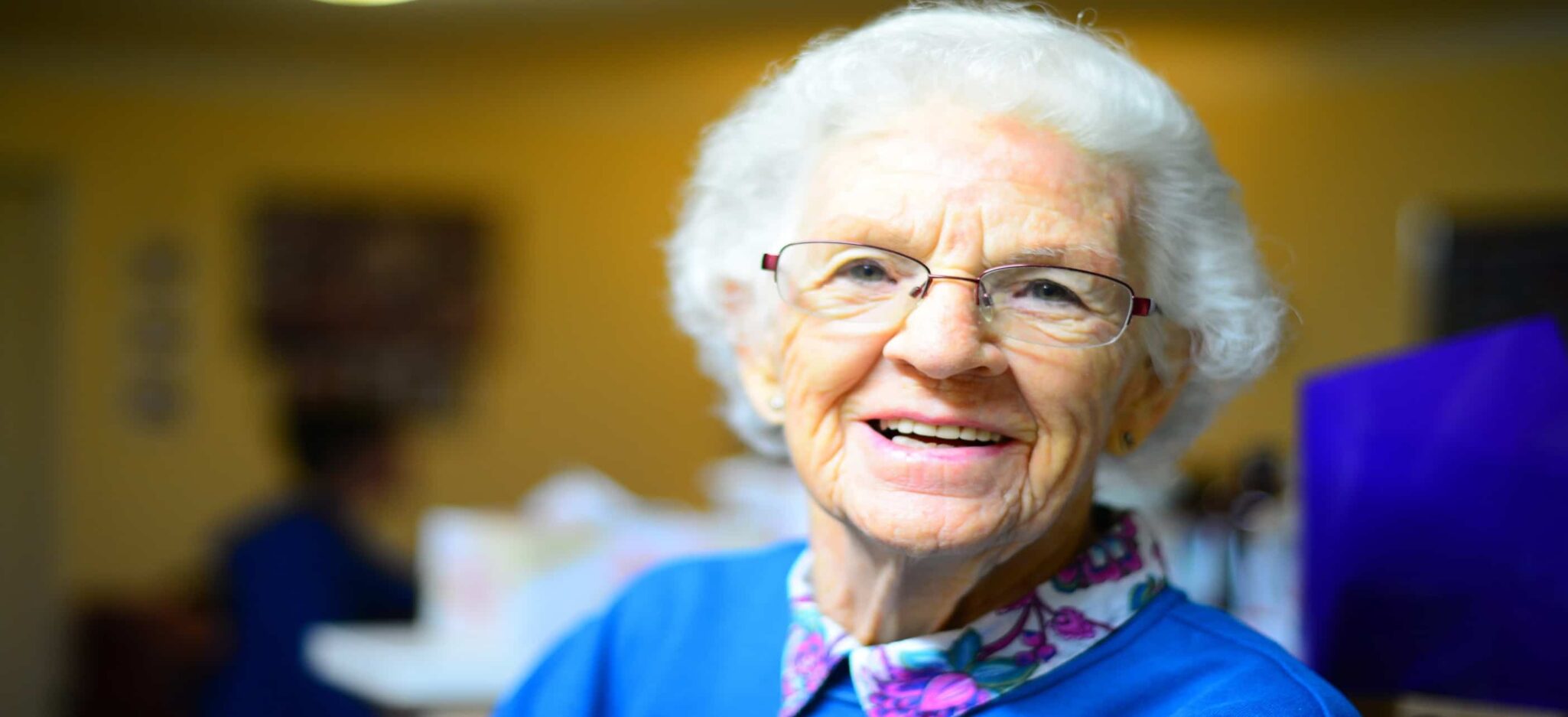 Smiling elderly woman with glasses